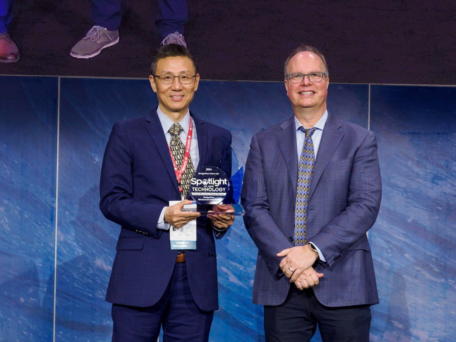 BridgeFlow receiving the 2024 OTC Spotlight on New Technology Small Business Award